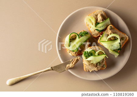 Toasts with pate on a beige background. 110819160