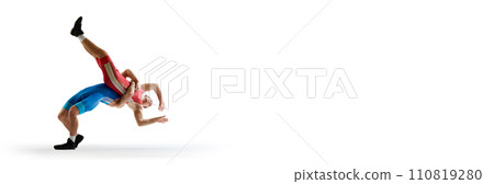 Banner. Two athlete man, freestyle wrestlers fighting against white studio background with negative space to insert text. Banner. Two athlete man, freestyle wrestlers fighting against white studio background with negative space to insert text. 110819280