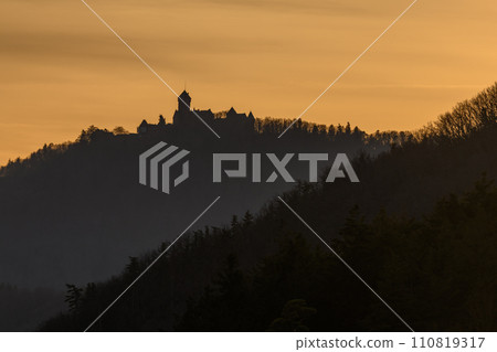 Silhouette of the Haut Koenigsbourg castle on the top of a mountain. 110819317