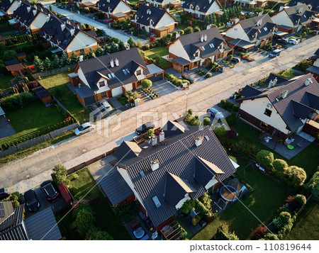 Aerial view of family houses in suburban neighborhood, Residential buildings in small town, Real estate in Poland with townhouses 110819644