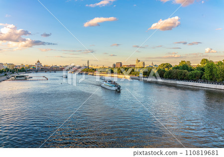 Cruise ship sails on the Moscow river in Moscow city center, popular place for walking. Cruise ship sails on the Moscow river in Moscow city center, popular place for walking. 110819681