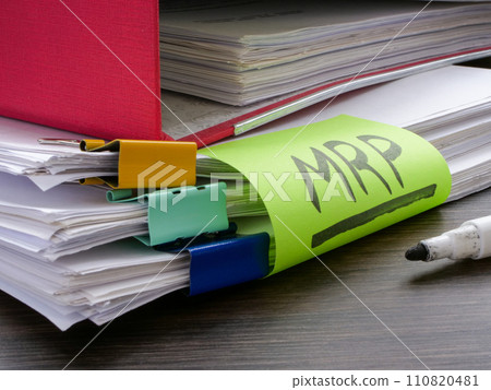 Stack of papers and label MRP Material requirements planning. Stack of papers and label MRP Material requirements planning. 110820481