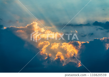 Dramatic cloudy sky background. Orange cloudy sunset sky. Dramatic cloudy sky background. Orange cloudy sunset sky. 110820539