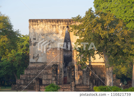 The buddha in Wat Si Chum in Sukhothai Historical Park, pagoda stupa, Sukhothai, Thailand. Thai buddhist temple architecture. Tourist attraction. The buddha in Wat Si Chum in Sukhothai Historical Park, pagoda stupa, Sukhothai, Thailand. Thai buddhist temple architecture. Tourist attraction. 110821739