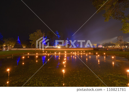 Sukhothai Historical Park festival, buddha pagoda stupa in a temple, Sukhothai, Thailand. Thai buddhist temple architecture at night. Tourist attraction. Sukhothai Historical Park festival, buddha pagoda stupa in a temple, Sukhothai, Thailand. Thai buddhist temple architecture at night. Tourist attraction. 110821781