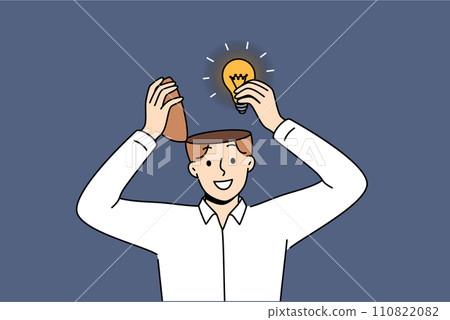Man genius with new idea takes light bulb out of head after brainstorming to achieve success 110822082