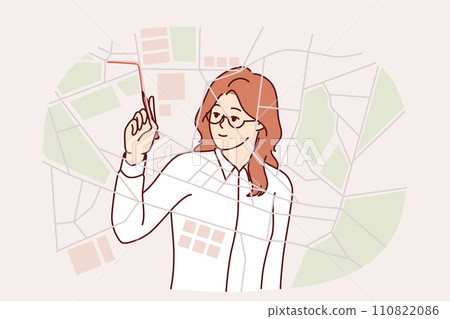 Woman logistician draws up route for delivery service vehicles by drawing lines on city map 110822086
