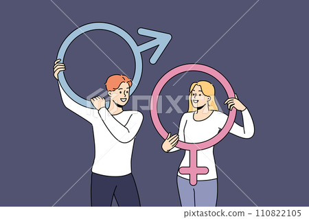 Couple of man and woman hold gender badges and smile, feeling respect for opposite sex Couple of man and woman hold gender badges and smile, feeling respect for opposite sex 110822105