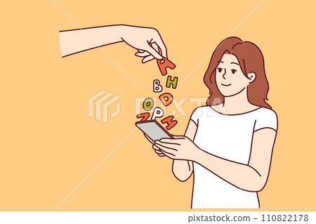 Teenage girl experiences digital addiction, and holds smartphone stands near hand with letters 110822178