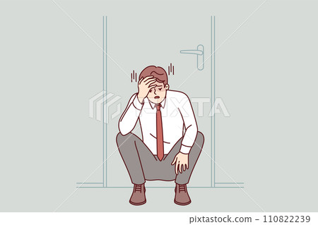 Frustrated businessman feels powerless when learns that bankruptcy, sits sadly under door in office 110822239