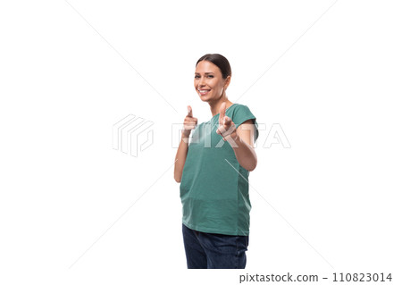 young joyful positive black-haired woman in a green basic t-shirt on a white background with copy young joyful positive black-haired woman in a green basic t-shirt on a white background with copy 110823014
