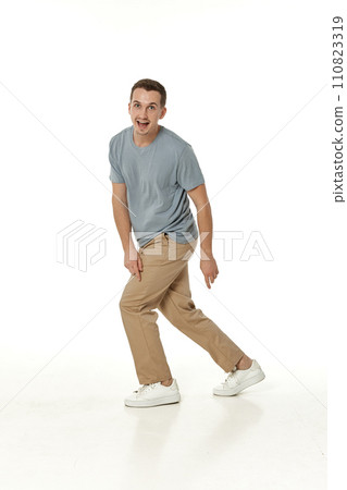 surprised guy looking at camera on white studio background surprised guy looking at camera on white studio background 110823319