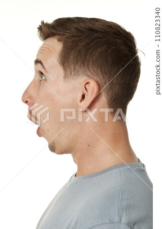 surprised guy looking at camera on white studio background surprised guy looking at camera on white studio background 110823340