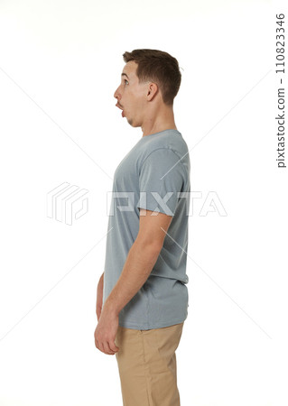 surprised guy looking at camera on white studio background surprised guy looking at camera on white studio background 110823346
