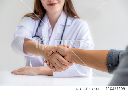 handshake after Doctors advice report health examination results and recommend medication to patients, occupational consultation medical checkup program concept handshake after Doctors advice report health examination results and recommend medication to patients, occupational consultation medical checkup program concept 110823509