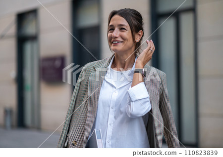 Pretty smiling woman looking confident and determined 110823839
