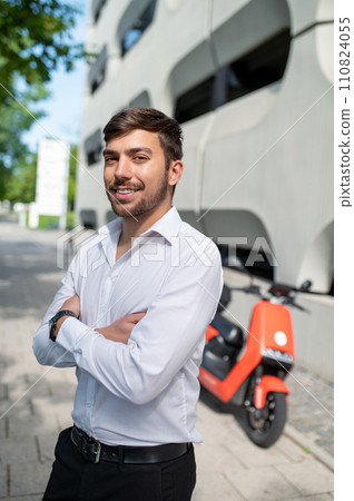 Young man in the city center on a big building background 110824055