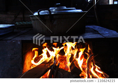 Firewood and flames burning in a Brazilian fireplace 110824215