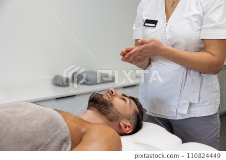 Young man having relaxing procedures in a massage salon Young man having relaxing procedures in a massage salon 110824449