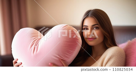 Happy young girl holding heart shaped pink pillow. Banner perfect for Valentines Day card, romantic themed design, voucher, greeting card, print. Concept love. Copy space. 110825034