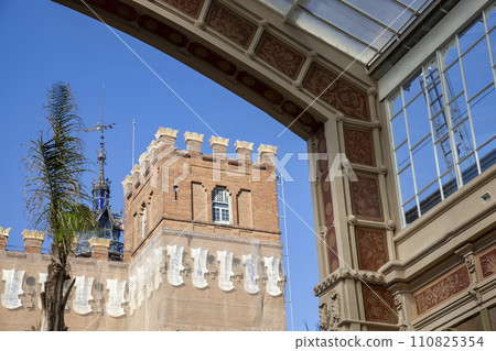 Greenhouse. Greenhouse located in a park in Barcelona, a city in Spain. Exterior architecture on a clear day. BARCELONA, SPAIN - JANUARY. 22, 2024. Greenhouse. Greenhouse located in a park in Barcelona, a city in Spain. Exterior architecture on a clear day. BARCELONA, SPAIN - JANUARY. 22, 2024. 110825354