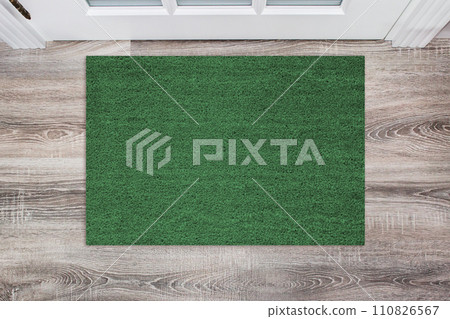 Green Coir Doormat on a wooden floor in front of the door. Product mockup Green Coir Doormat on a wooden floor in front of the door. Product mockup 110826567
