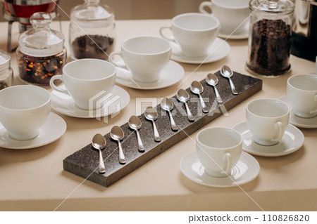 Coffee or tea cups on catering table at conference or wedding banquet table Coffee or tea cups on catering table at conference or wedding banquet table 110826820