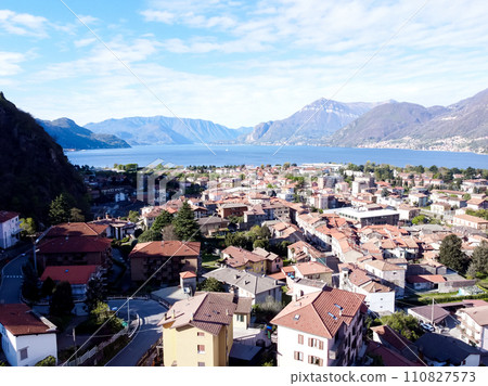 The Italian valley of Lake Como among the picturesque foggy peaks of the Alps. The Italian valley of Lake Como among the picturesque foggy peaks of the Alps. 110827573