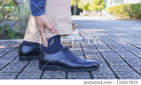 A man with foot pain | Image of shoe blisters, foot fatigue, etc. 110827659