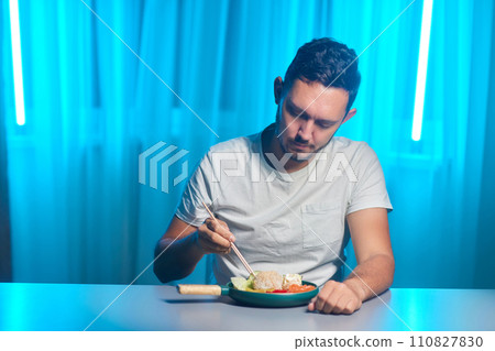 Unrecognizable man eating poke bowl with salmon,avocado,seaweed Unrecognizable man eating poke bowl with salmon,avocado,seaweed 110827830