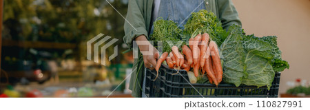 Close up of woman farmer with just harvested vegetables basket ready to sale. Agricultural concept 110827991