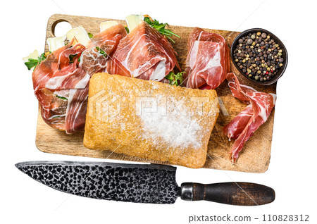 Ciabatta sandwich with prosciutto crudo ham, arugula and camembert brie cheese. Isolated on white background, Top view. 110828312