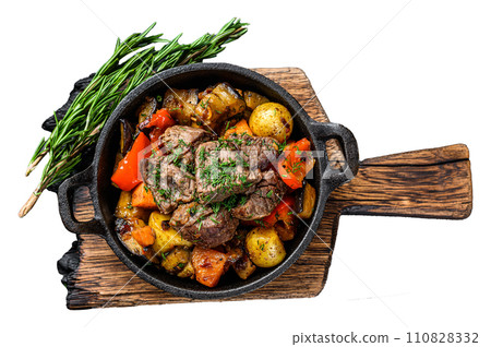 Meat stew in cooking pot on dark rustic cutting board. Isolated on white background, Top view. 110828332