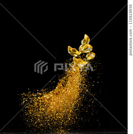 Gold Ingot Chinese Money bar token fly with dust particle in air. Chinese new year Yuanbao gold ingots floating to golden money sand particle. Language is wealthy prosperity. Black background isolated Gold Ingot Chinese Money bar token fly with dust particle in air. Chinese new year Yuanbao gold ingots floating to golden money sand particle. Language is wealthy prosperity. Black background isolated 110828656