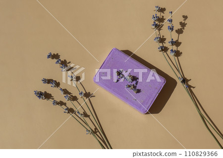 Handmade aromatic spa lavender soap. Natural additives and extracts. Bar of lavender soap with dried flowers. Beauty treatment product herbal ecological organic cosmetics 110829366