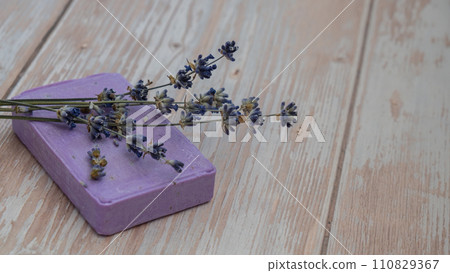 Lavender soap on wooden background with copy space for your text. Advertisement template mock up. Skincare homemade natural cosmetic concept. Organic dry lavender flower 110829367