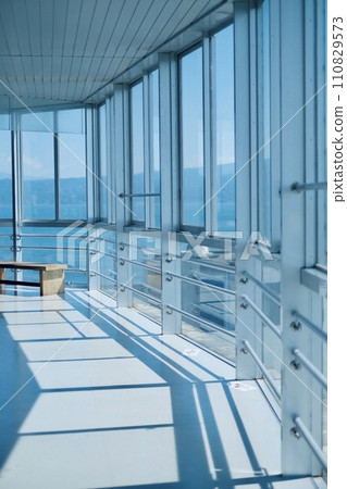 The sea through the glass from the observation deck 110829573