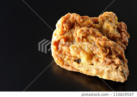 Fried chicken photographed against a black background 110829587