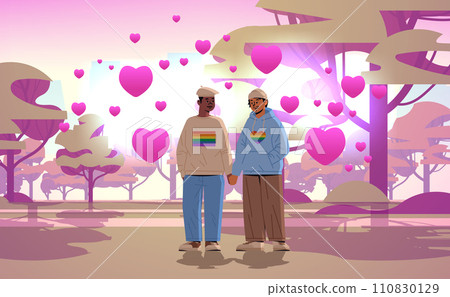 gays couple in love holding hands lgbt rainbow flag gay lesbian love parade pride festival transgender love valentines day celebration concept 110830129