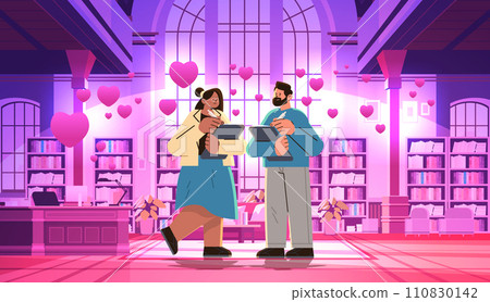 man woman couple in love reading books in library with pink hearts happy valentines day celebration concept horizontal man woman couple in love reading books in library with pink hearts happy valentines day celebration concept horizontal 110830142