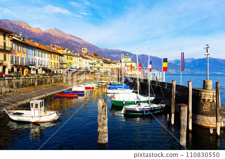 Buildings and boats along lakeshore in Cannobio, Piedmont, Italy 110830550