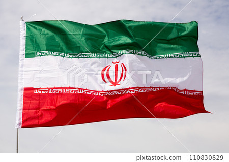 Flag of Iran waving on cloudy sky during daytime Flag of Iran waving on cloudy sky during daytime 110830829