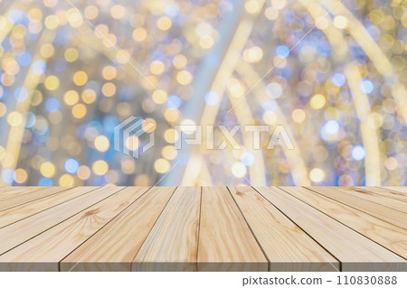 Empty wood table top with blur Christmas tree with bokeh light background Empty wood table top with blur Christmas tree with bokeh light background 110830888