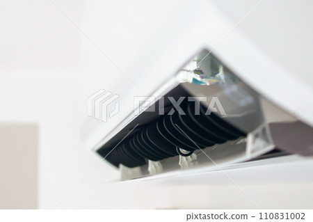 Air conditioner on white wall room interior background Air conditioner on white wall room interior background 110831002