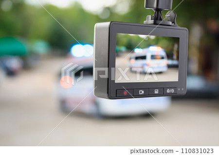 Car CCTV camera video recorder with ambulance car on the road 110831023