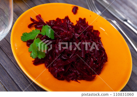 Salad of grated baked beetroot garnished with fresh parsley Salad of grated baked beetroot garnished with fresh parsley 110831060