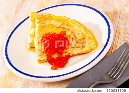 Tasty pancakes with caviar at plate, nobody Tasty pancakes with caviar at plate, nobody 110831106