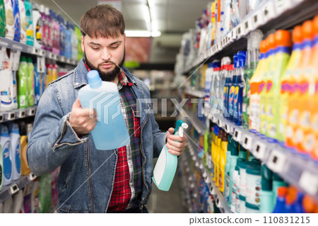 Man buying household detergents Man buying household detergents 110831215