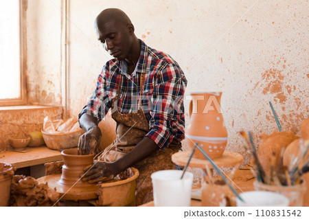 Man making ceramics on pottery wheel Man making ceramics on pottery wheel 110831542