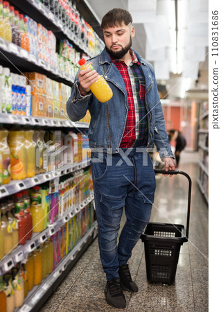 Man purchasing sweet soft drinks Man purchasing sweet soft drinks 110831686